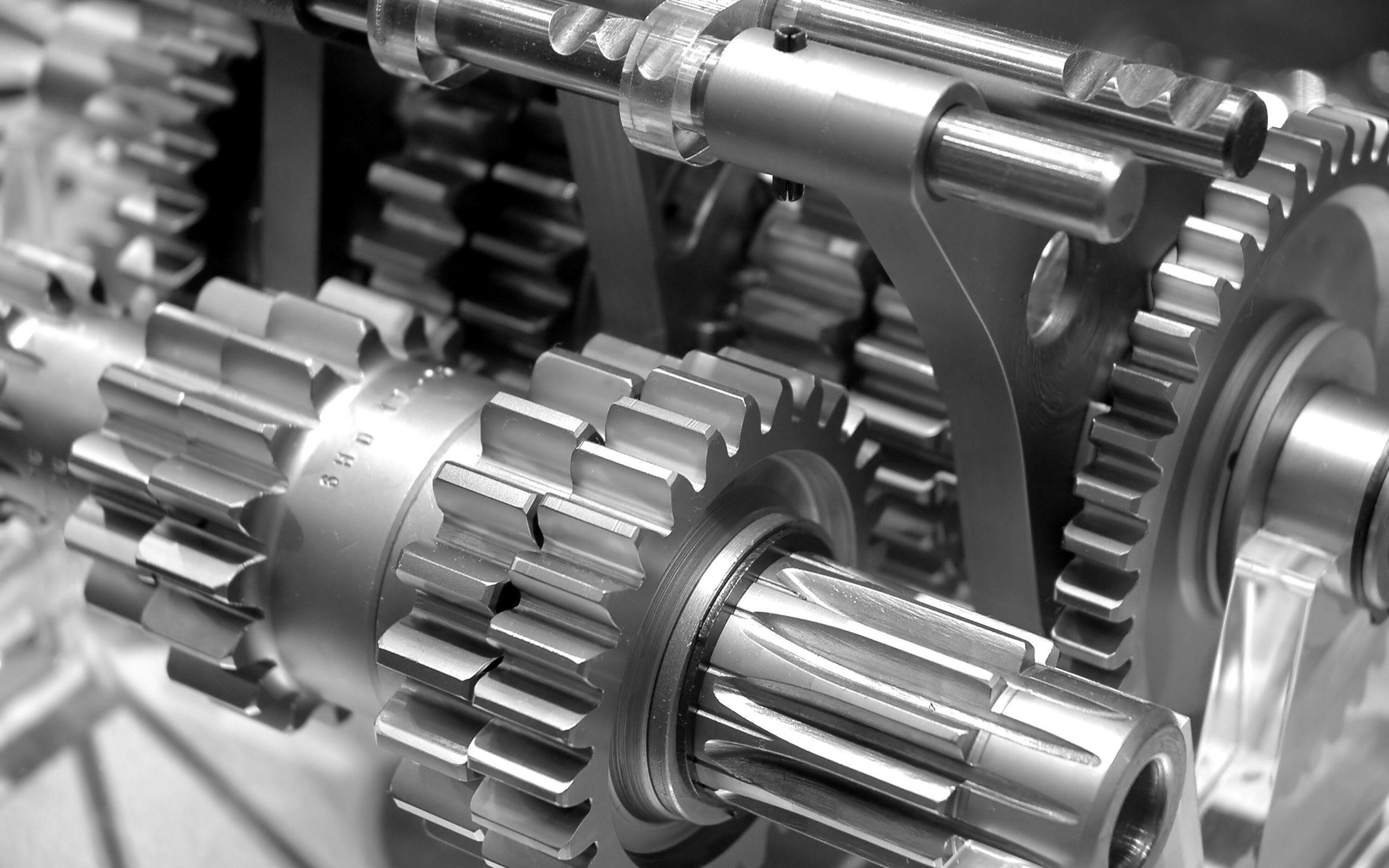 Precision-engineered industrial machinery — polished metal components on a production floor